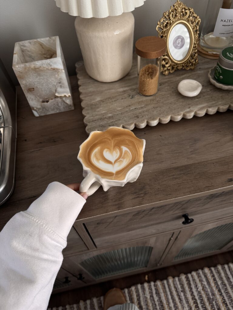 hot latte in a beautiful unique white ceramic mug 