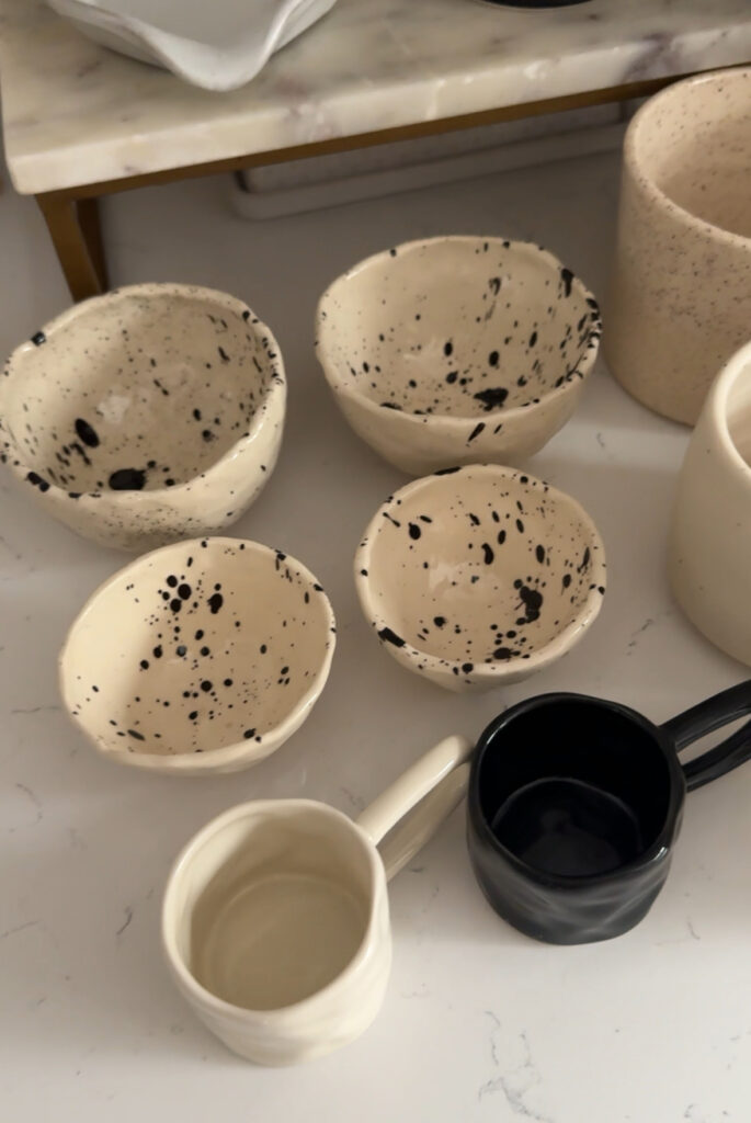 beautiful caramic espresso mini mugs in neutral colors on a marble countertop