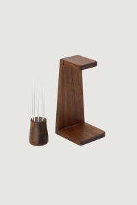 wooden and silver WDT tool on a beige background